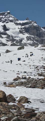 trekking up the Miyar Glacier, immense peaks all around