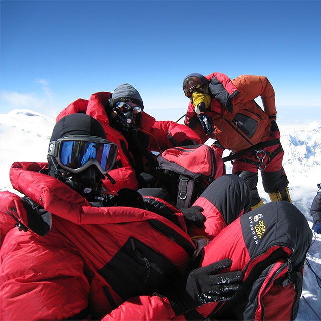 David Cole, Anselm Muphy and Chewang Palden on the summit of Everest