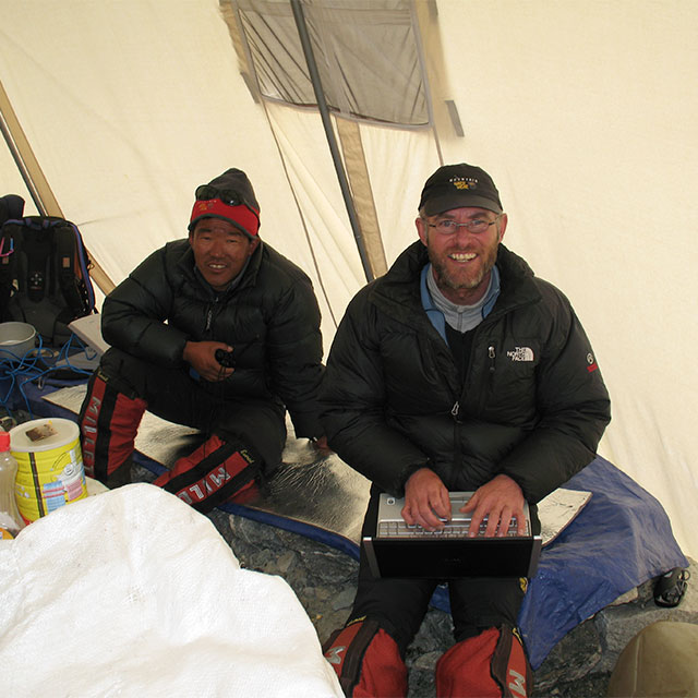 Jamie writing a dispatch at C2